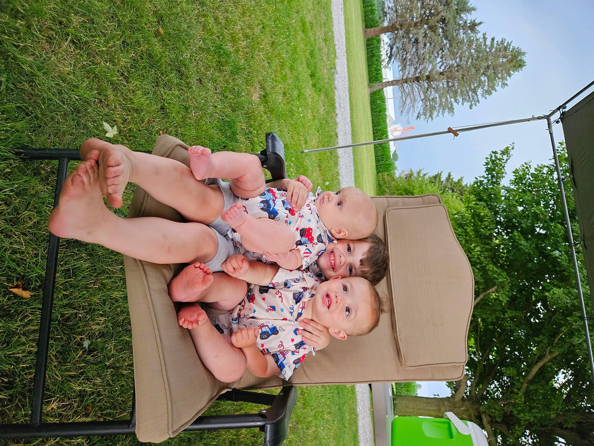 Reese joined the competition — help win amazing prizes! baby, foot, fun, grass, green, happy, human_leg, joy, leg, leisure, outdoor_furniture, people_in_nature, person, plant, recreation, sandal, shorts, sky, spring, summer