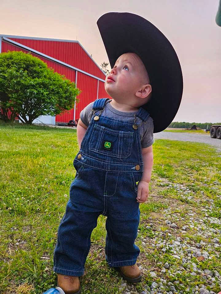 Reese is registered to the contest to win money with this photo: baby, baby_toddler_clothing, child, denim, eye, fun, grass, grass_family, grassland, happy, hat, headwear, landscape, leaf, leisure, pattern, people_in_nature, person, plant, sky