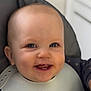 Hillarya participe au concours pour gagner de l'argent avec cette photo : baby, child, smiling, face, eyes, teeth, bib, high_chair, indoor, closeup, happy, cute, skin, head, infant, person, clothing, blue, white, background_blur