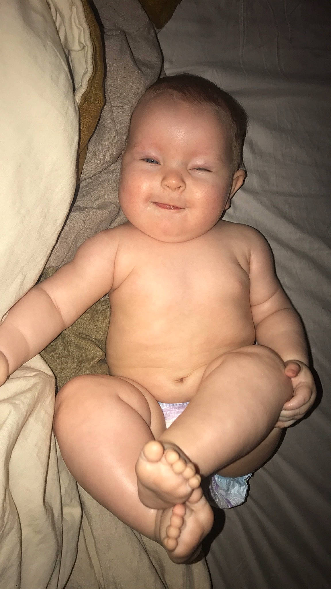 Gwendolyn is registered to the contest to win money with this photo: baby, cheek, chest, comfort, elbow, face, finger, flash_photography, hand, joy, knee, lip, mouth, nose, organ, person, skin, smile, stomach, thigh