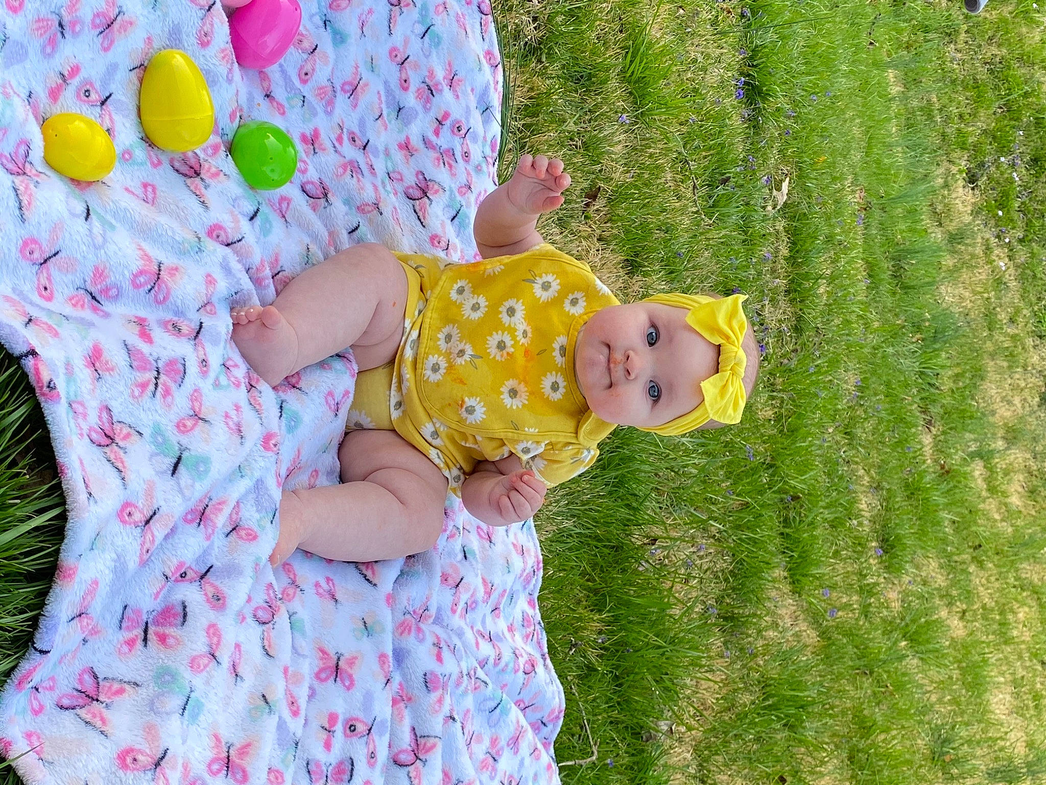 Gwendolyn is registered to the contest to win money with this photo: baby, baby_toddler_clothing, dress, fun, grass, green, happy, hat, headwear, leaf, mammal, pattern, people, people_in_nature, person, pink, plant, sleeve, summer, textile