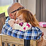 Piper joined the competition — help win amazing prizes! affection, child, closeup, comfort, embrace, family, floral_sweater, glasses, home, hug, indoor, love, man, pacifier, person, plaid_shirt, red_hair, seated, toddler, wooden_chair
