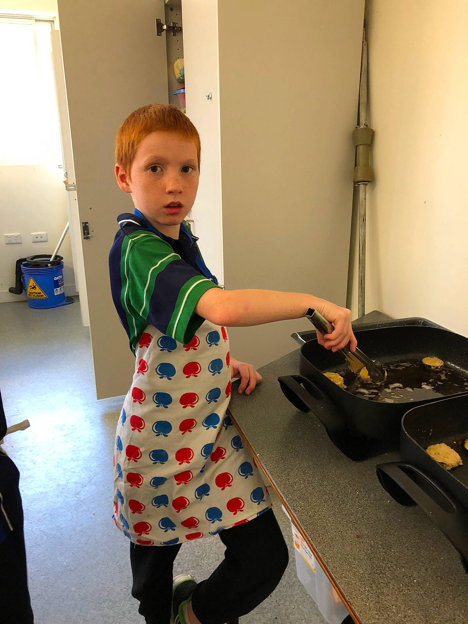 Kain is registered to the contest to win money with this photo: baby_toddler_clothing, bag, child, elbow, floor, flooring, fun, gesture, hairstyle, happy, homemaker, luggage_and_bags, pattern, person, play, shoulder, sleeve, snapshot, thumb, toddler