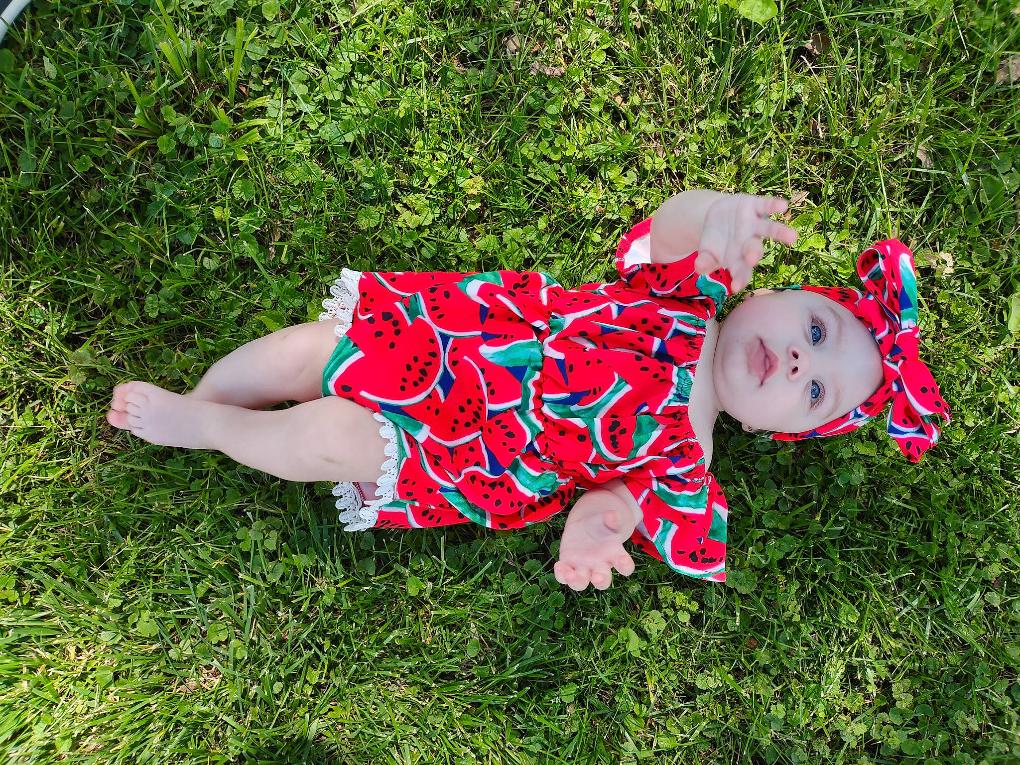 Kingsley is registered to the contest to win money with this photo: baby, baby_toddler_clothing, dress, grass, grass_family, grassland, groundcover, happy, hat, headwear, human_leg, lawn, leisure, meadow, pattern, people_in_nature, person, plant, shoe, thigh