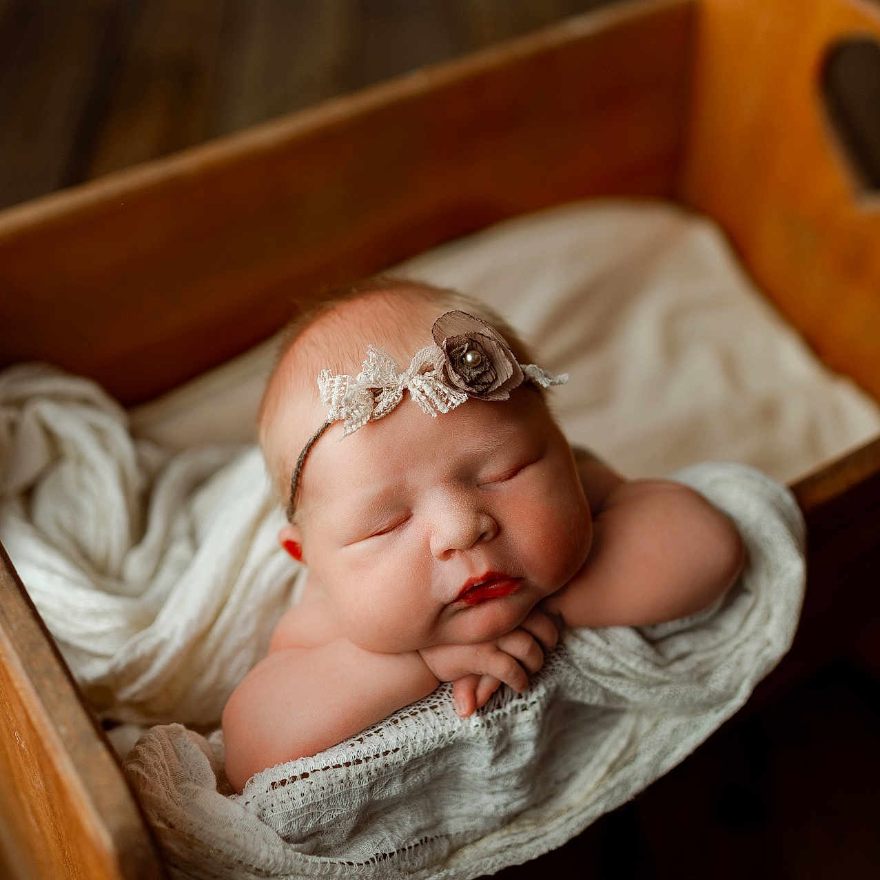 Rory is registered to the contest to win money with this photo: baby, bed, bodypart, cradle, crib, drawer, face, finger, furniture, hand, hardwood, head, infantbed, newborn, person, sleeping, wood