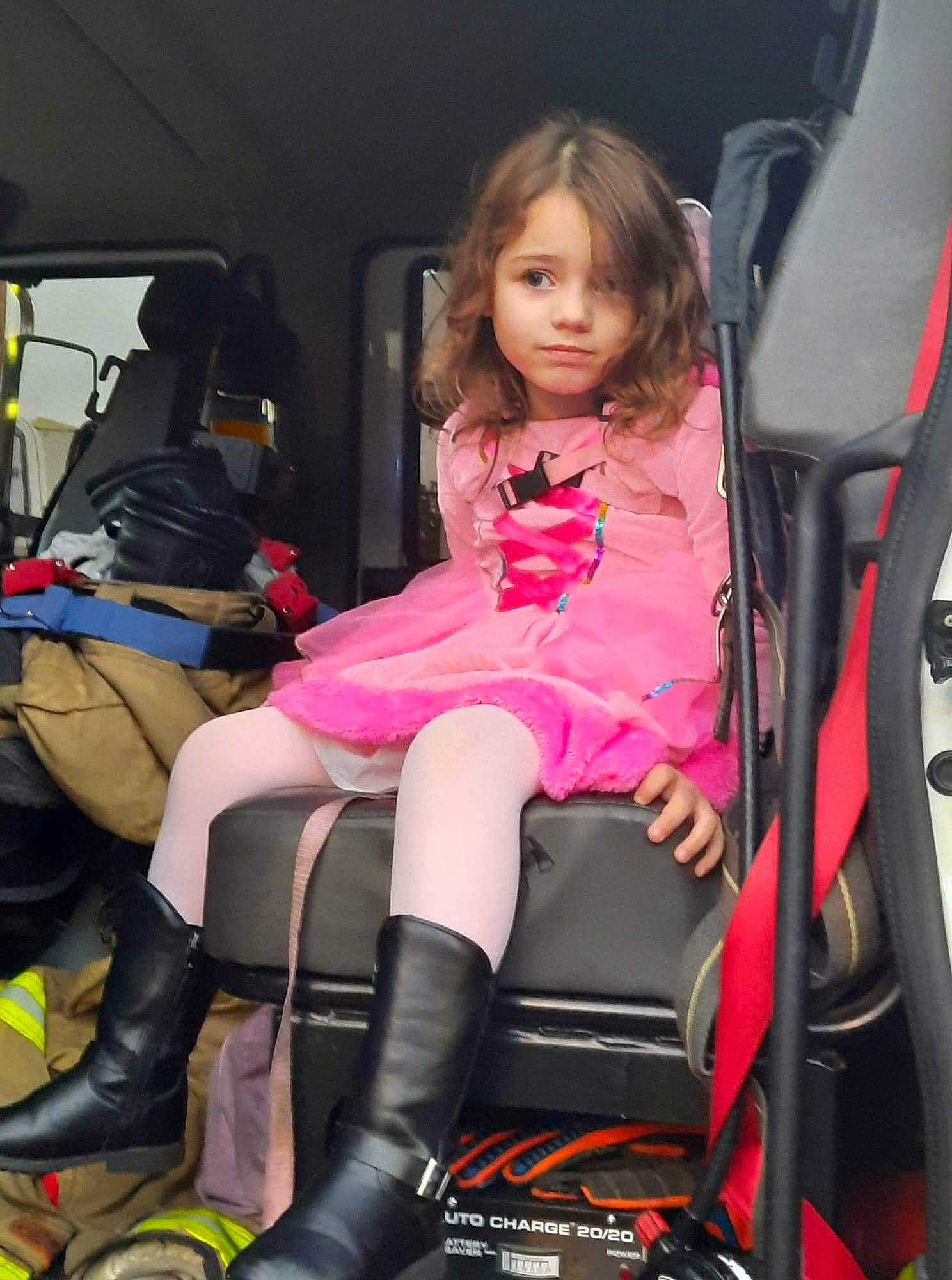 Briella is registered to the contest to win money with this photo: auto_part, automotive_design, automotive_exterior, blond, car_seat, car_seat_cover, chair, comfort, fun, human_leg, knee, magenta, motor_vehicle, passenger, person, product, sitting, steering_wheel, thigh, toddler