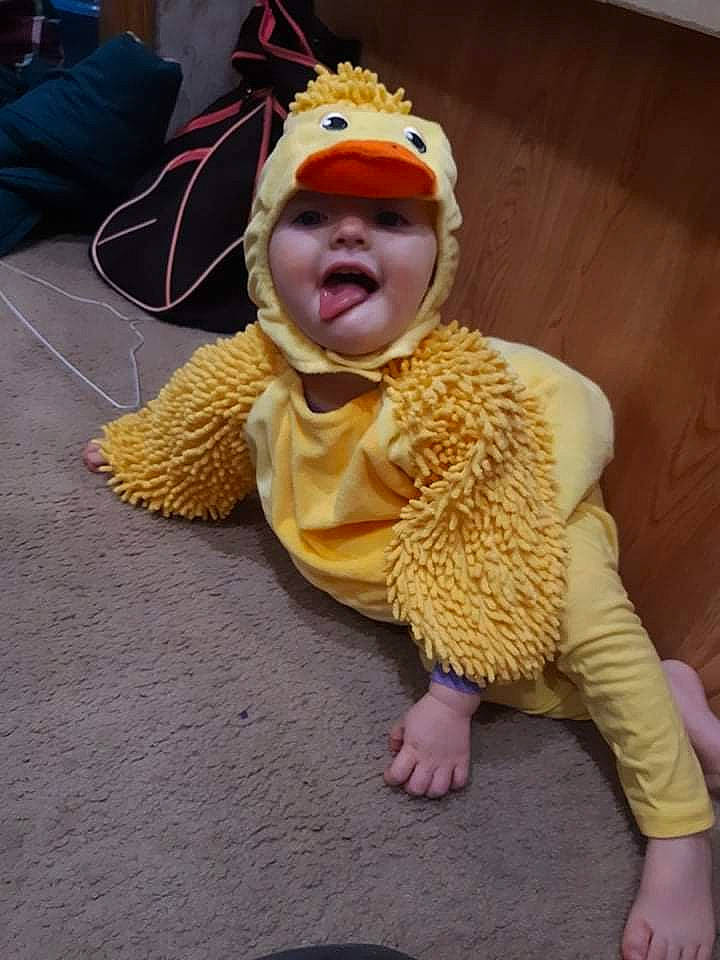 Addylynn joined the competition — help win amazing prizes! baby, baby_toddler_clothing, beanie, cap, child, costume, costume_hat, floor, flooring, foot, fun, fur, headwear, knit_cap, knitting, person, personal_protective_equipment, sitting, toddler, wood