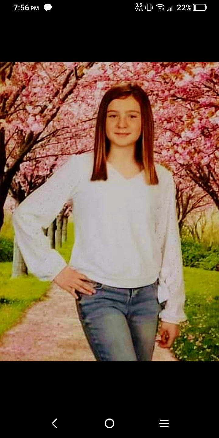 Madison is registered to the contest to win money with this photo: blossom, branch, brown_hair, denim, fashion_model, flash_photography, gesture, grass, happy, joy, leisure, lip, long_hair, peach, people_in_nature, person, plant, sleeve, textile, thigh