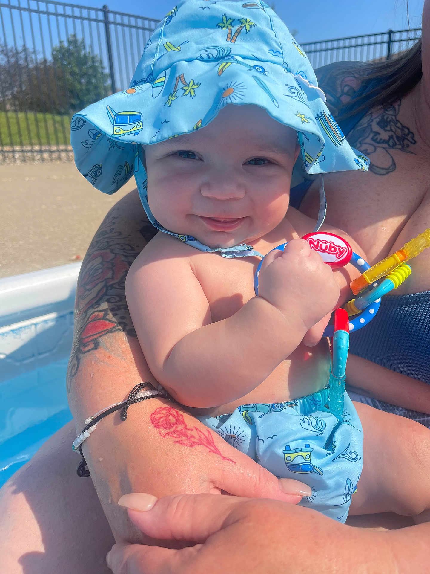 Legend is registered to the contest to win money with this photo: accessories, baby, bikini, bodypart, cap, clothing, face, hat, head, person, photography, pool, portrait, shorts, skin, summer, swimmingpool, swimwear, tattoo, water