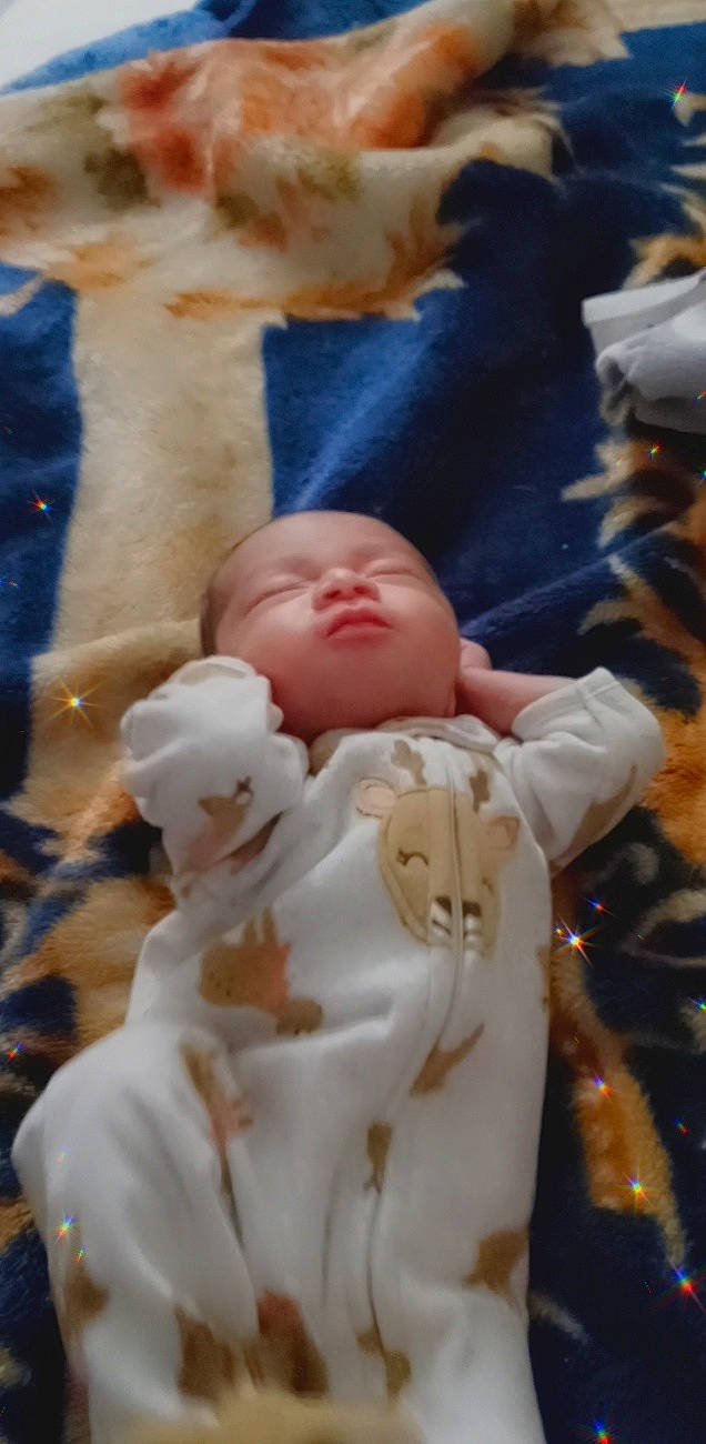 Xzavia is registered to the contest to win money with this photo: baby, baby_products, baby_sleeping, baby_toddler_clothing, bedtime, cheek, child, comfort, eye, finger, fur, gesture, head, human_body, linens, mouth, nap, nose, person, textile