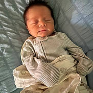 Isaiah joined the competition — help win amazing prizes! newborn, baby, sleeping, blanket, pajamas, striped_clothing, bed, quilted_bedspread, infant, cute, peaceful, indoors, portrait, resting, child, soft_lighting, toddler, sleep, cozy, hair