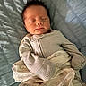 baby, bed, blanket, child, cozy, cute, hair, indoors, infant, newborn, pajamas, peaceful, portrait, quilted_bedspread, resting, sleep, sleeping, soft_lighting, striped_clothing, toddler