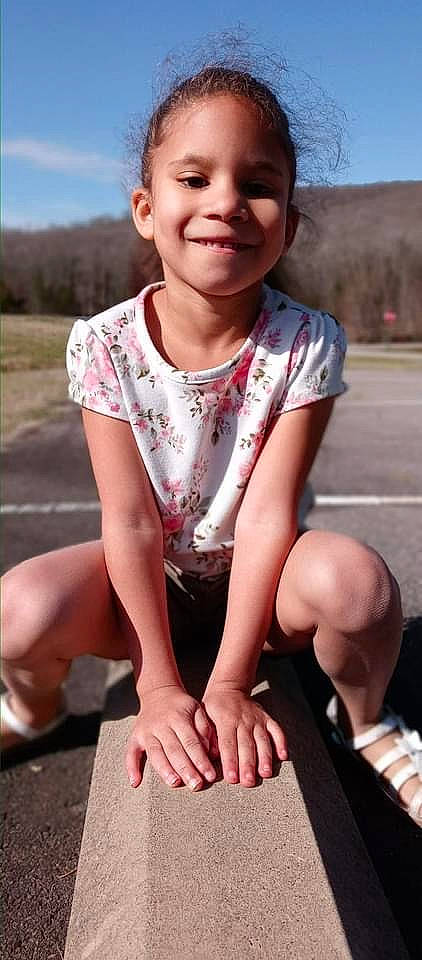 Amiya is registered to the contest to win money with this photo: chin, dress, grass, happy, joy, knee, leg, lip, muscle, neck, person, photograph, pink, shoulder, skin, sleeve, smile, summer, thigh, toddler