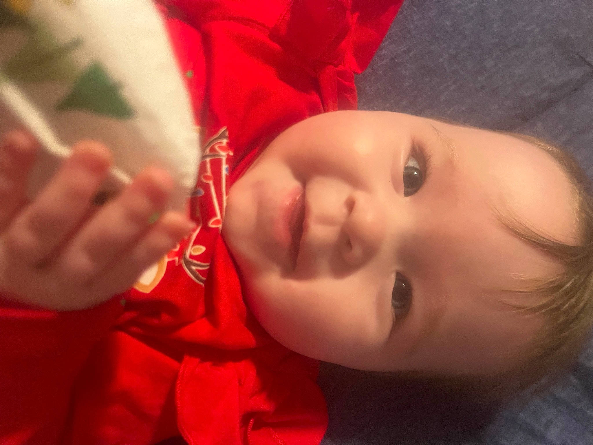 Everleigh is registered to the contest to win money with this photo: baby, cheek, chin, eye, eyebrow, eyelash, flash_photography, gesture, happy, head, human_body, iris, lip, mouth, neck, nose, person, plant, skin, smile