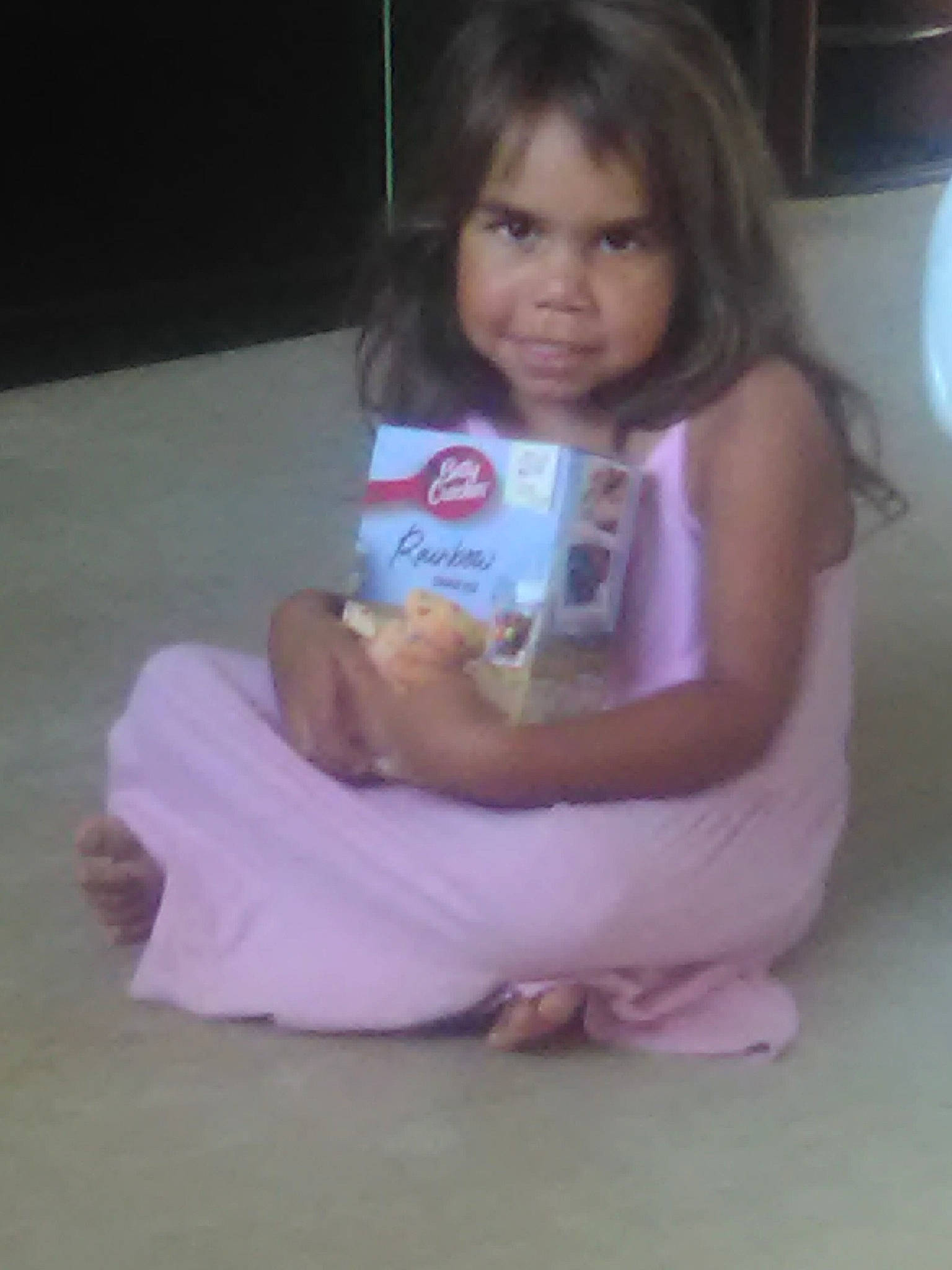 Alex is registered to the contest to win money with this photo: cheek, child, eye, eyelash, face, flooring, foot, fun, hair, happy, human_leg, iris, knee, long_hair, magenta, person, pink, sitting, skin, toddler