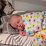 baby, sleeping, blanket, colorful, floral, towel, bed, resting, infant, peaceful, soft, cozy, child, portrait, indoors, cute, newborn, comfort, relaxation, face