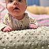 baby, infant, headband, flower, face, eyes, hand, blanket, texture, soft, indoor, closeup, curious, cute, child, portrait, clothing, pink, pastel, young