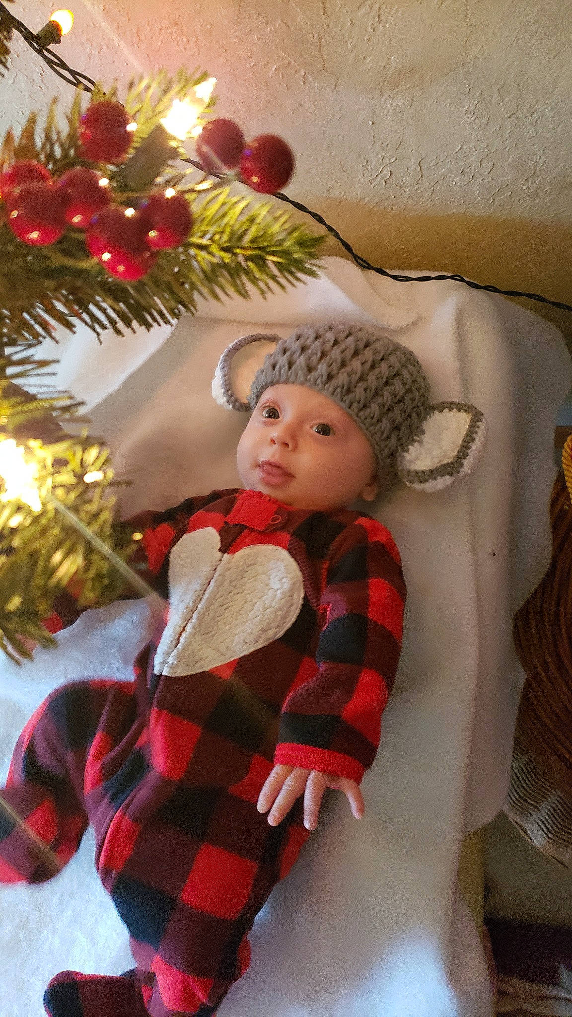 Dorian is registered to the contest to win money with this photo: child, christmas, christmas_decoration, christmas_eve, christmas_ornament, christmas_tree, fir, holiday, interior_design, person, toddler, tree