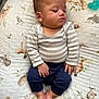 baby, sleeping, striped_shirt, navy_pants, blanket, woodland_animals, deer, squirrel, rabbit, bird, pacifier, infant, cute, cozy, soft, toddler, child, hands, feet, peaceful