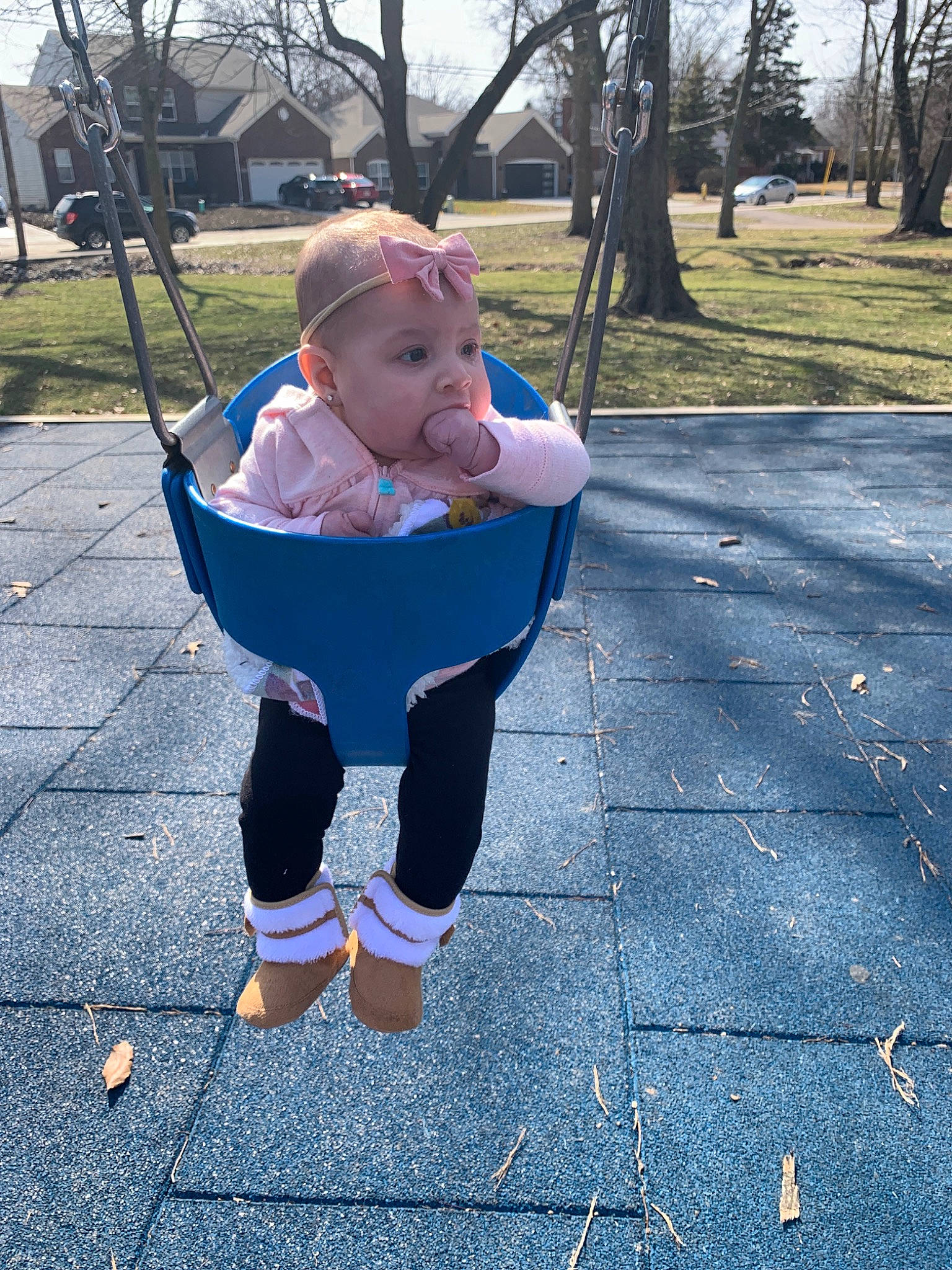 Lyla joined the competition — help win amazing prizes! baby, child, jeans, leaf, leg, leisure, outdoor_play_equipment, person, play, playground, public_space, sitting, swing, toddler, tree, vacation