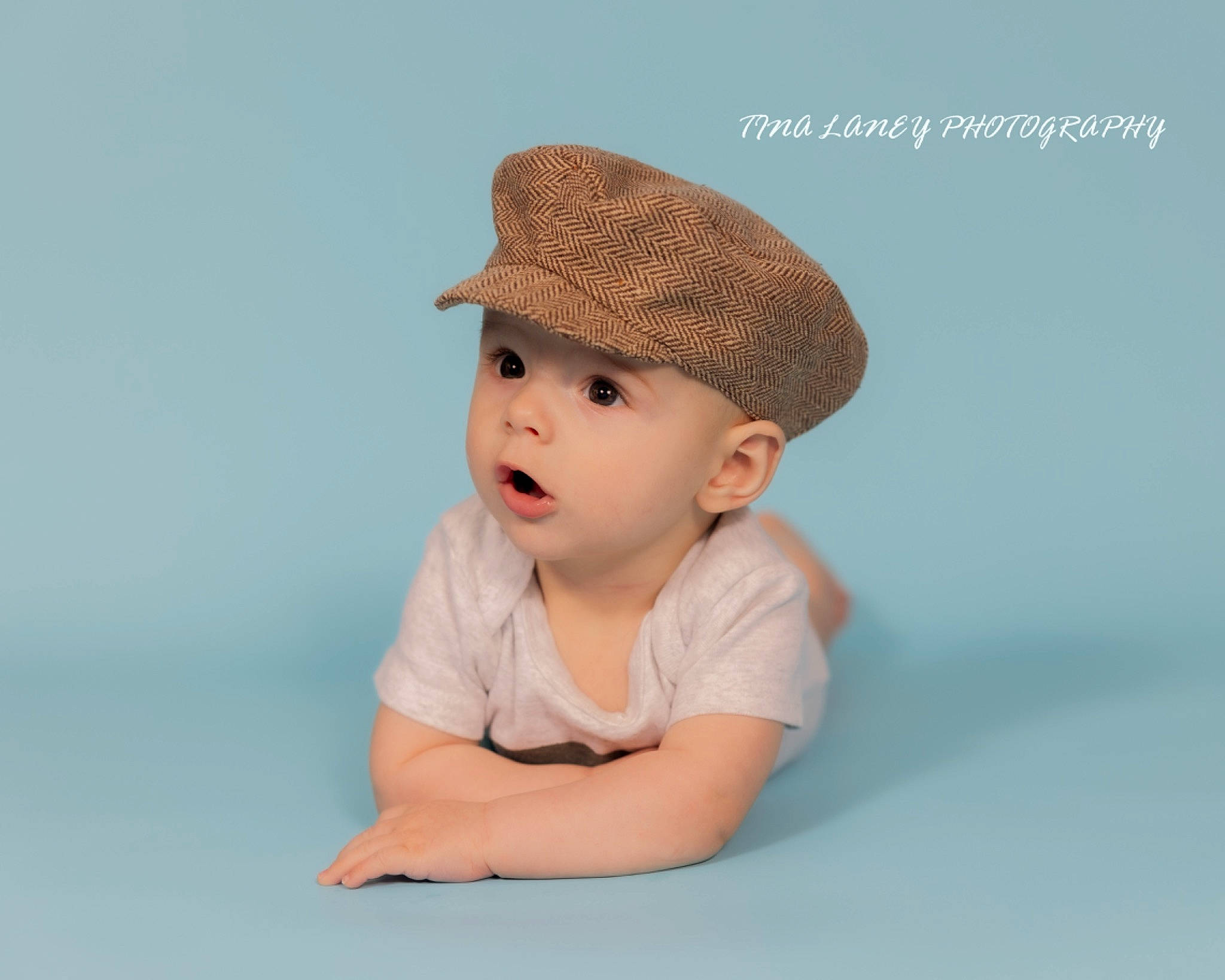Jaxton joined the competition — help win amazing prizes! baby, baby_toddler_clothing, beanie, cap, child, comfort, elbow, eye, fashion_accessory, flash_photography, happy, hat, head, headwear, knit_cap, person, portrait_photography, sitting, sleeve, t_shirt