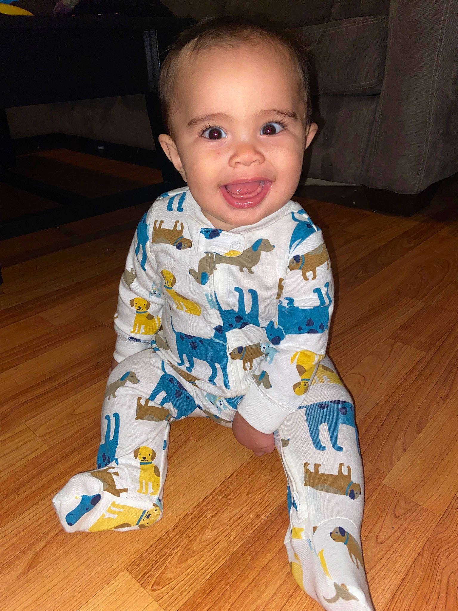 Indie is registered to the contest to win money with this photo: active_pants, baby, baby_toddler_clothing, barefoot, cheek, electric_blue, eye, face, floor, flooring, foot, happy, hardwood, head, human_body, human_leg, joy, person, sleeve, smile