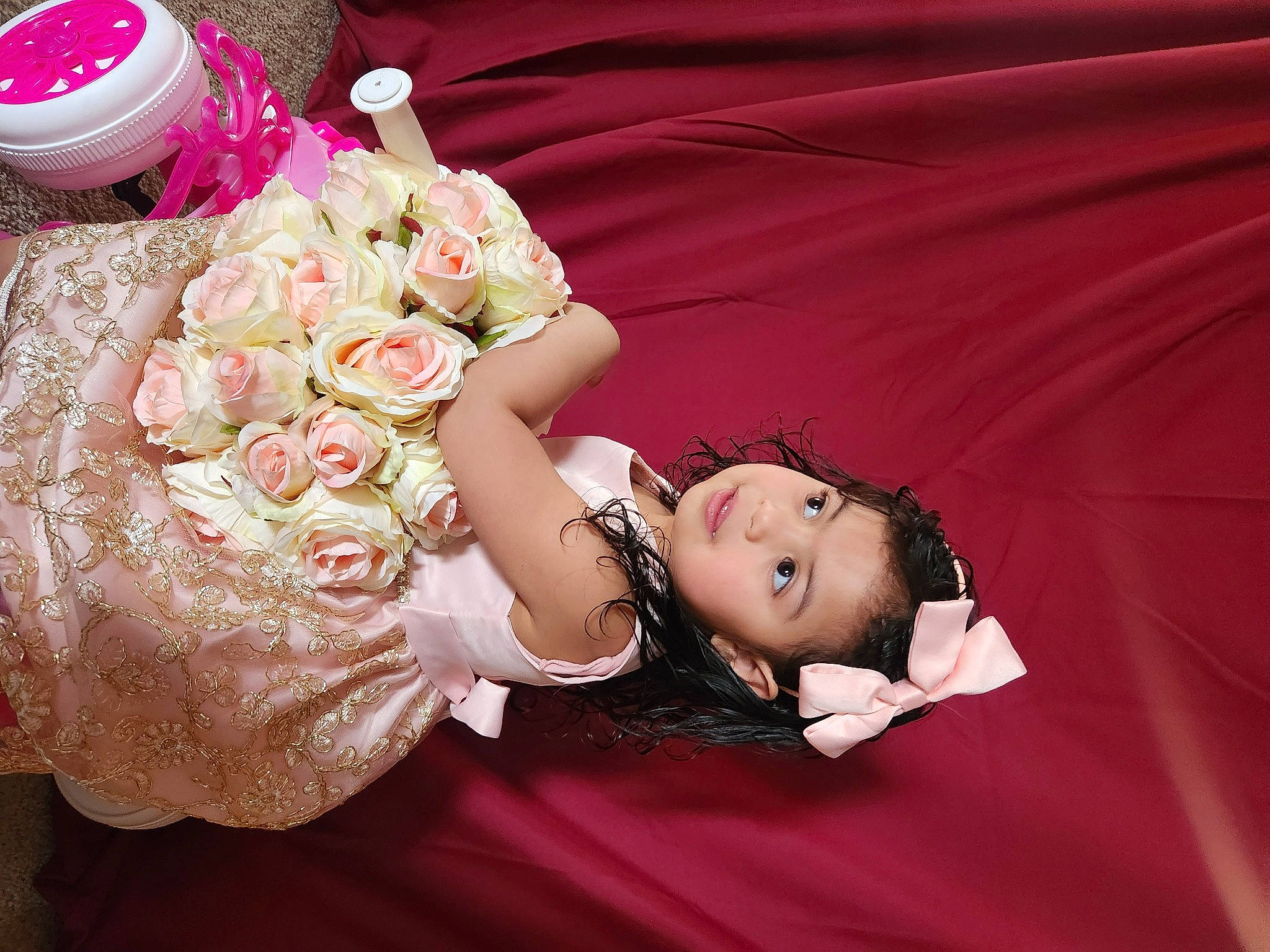 Aisha is registered to the contest to win money with this photo: baby, baby_toddler_clothing, dress, event, flash_photography, flower, flower_arranging, happy, headpiece, hybrid_tea_rose, jewellery, necklace, person, petal, pink, plant, rose, skin, smile, toddler