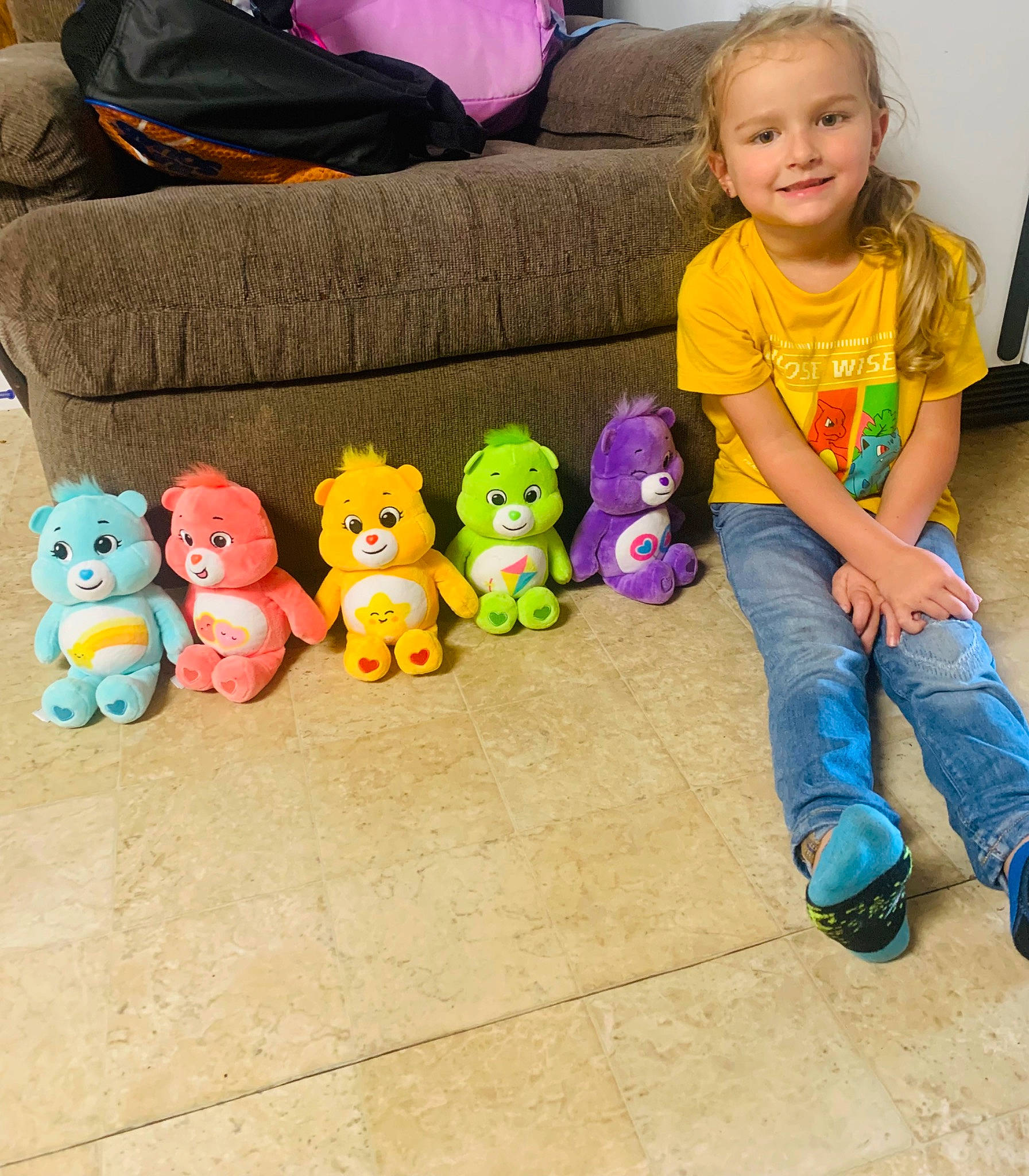 Lorelai joined the competition — help win amazing prizes! baby_toys, blue, child, comfort, couch, fun, happy, head, joy, lap, leg, leisure, person, plush, purple, shoe, sitting, smile, stuffed_toy, toddler