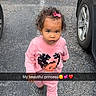 toddler, child, pink_clothing, curly_hair, bow, asphalt, parking_lot, car, shoe, sidewalk, outdoor, walking, person, serious_expression, cute, young_child, snapshot, text_overlay, emoji, pajamas