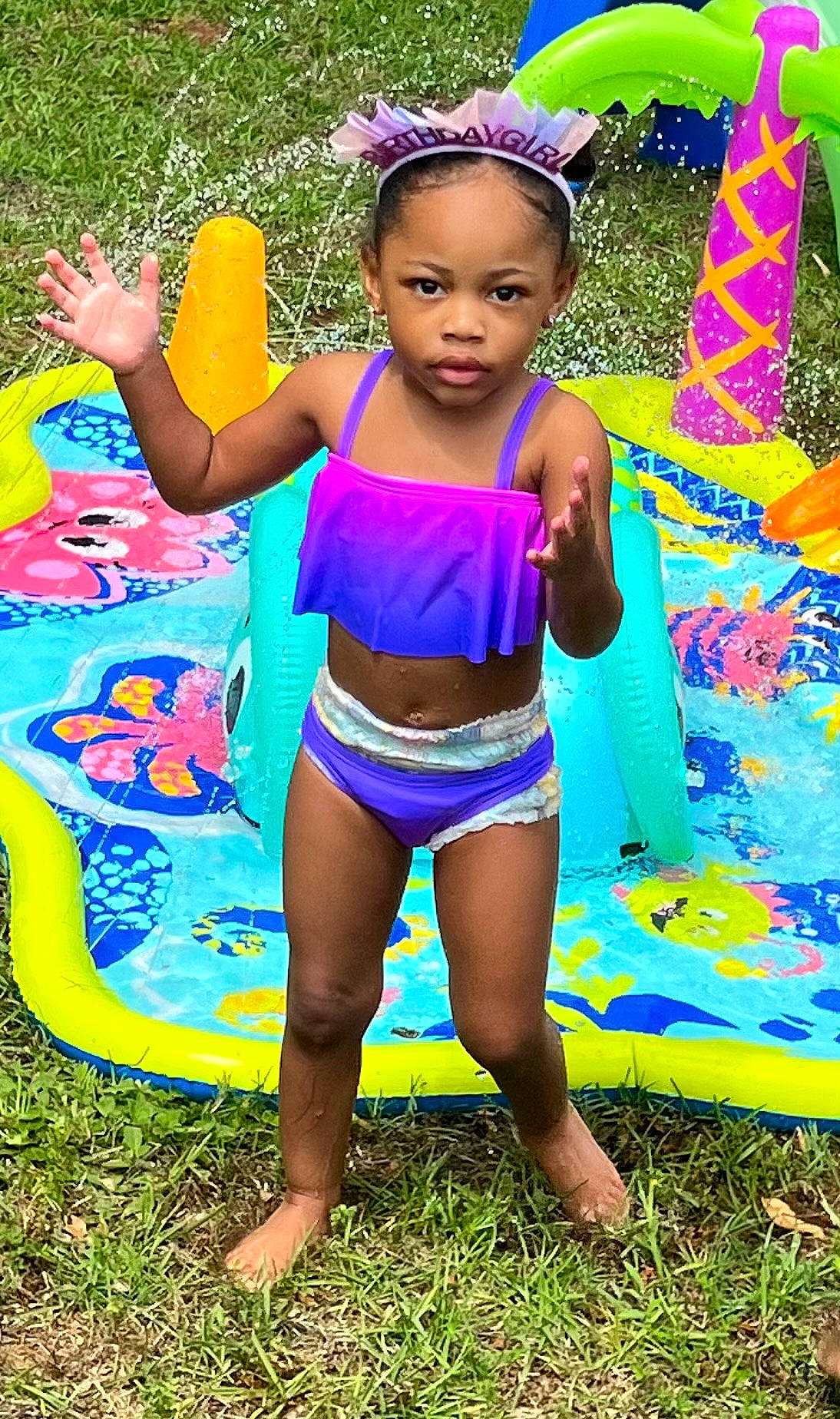 Hermione joined the competition — help win amazing prizes! barefoot, child, electric_blue, event, fun, grass, green, happy, human_leg, leisure, magenta, people_in_nature, person, pink, plant, recreation, swimwear, thigh, toddler, waist