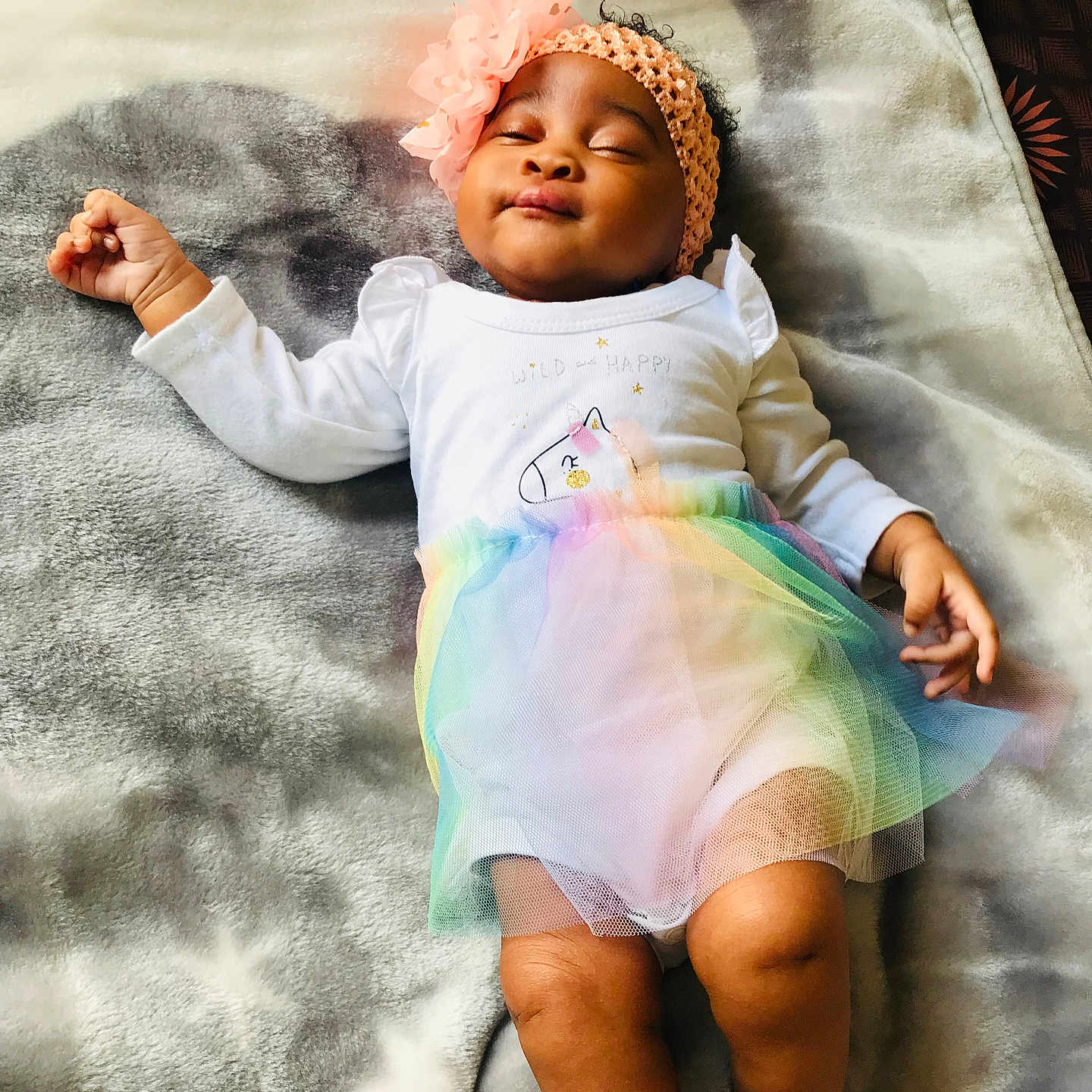Ithalam Isipho is registered to the contest to win money with this photo: baby, blanket, child, cute, flower, girl, headband, indoors, infant, peaceful, portrait, rainbow, relaxed, sleeping, smiling, soft_texture, star_pattern, tutu, unicorn, white_clothing