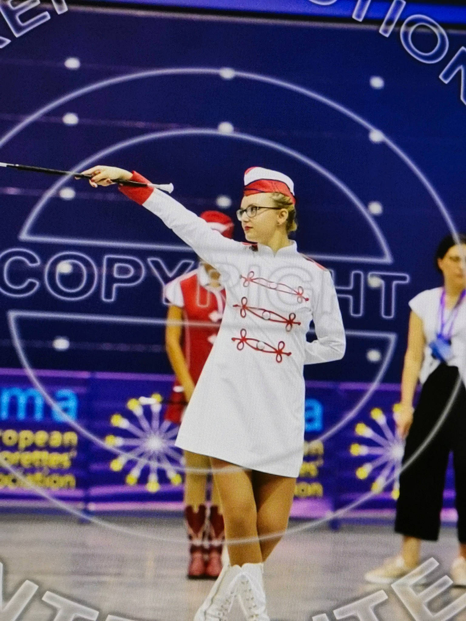 Leïna participe au concours pour gagner de l'argent avec cette photo : championship, competition_event, headwear, jersey, majorette_dancer, person, player, sports, sports_equipment, team_sport, tournament, uniform, world