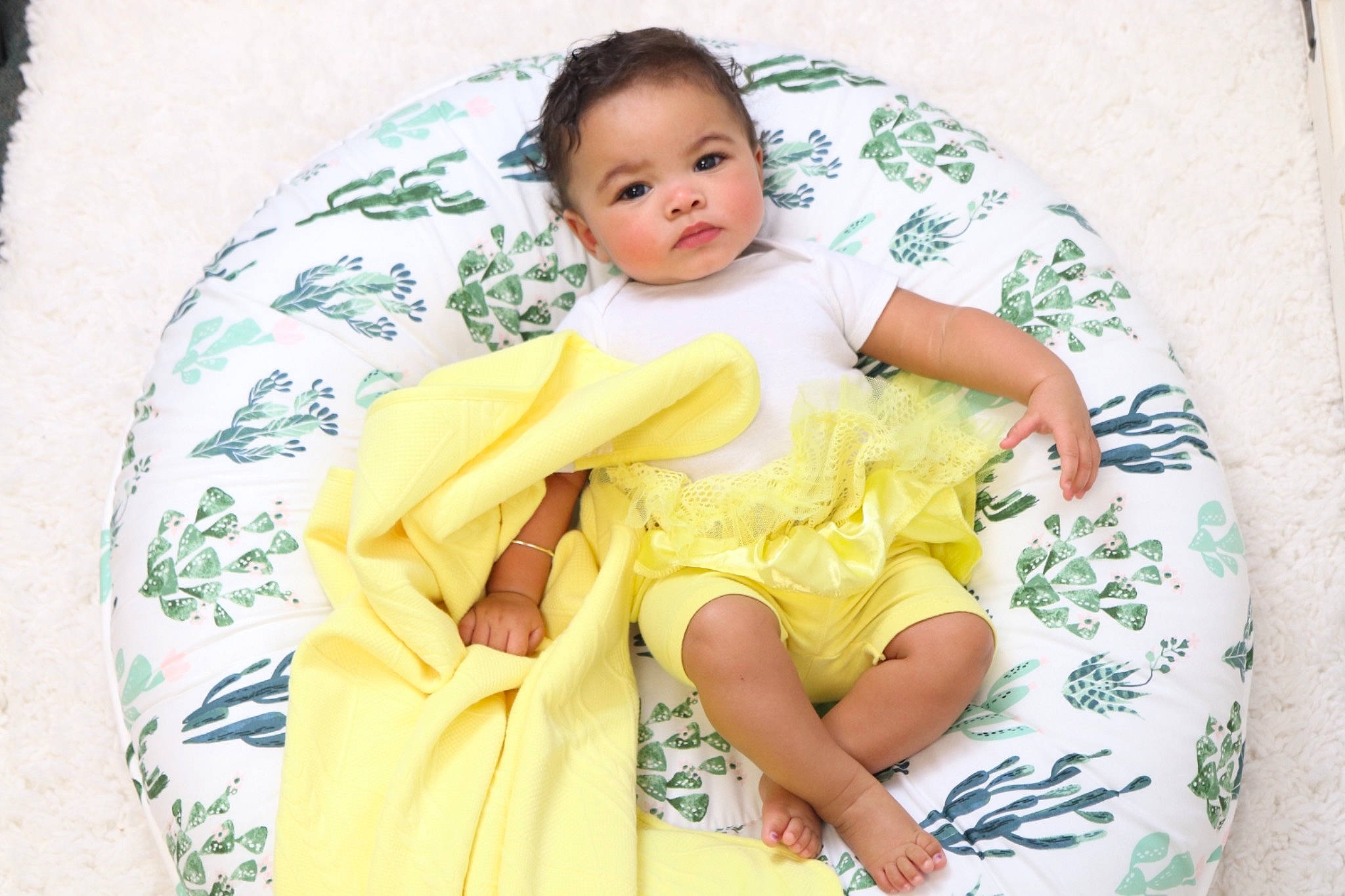 Chelsea joined the competition — help win amazing prizes! abdomen, baby, baby_products, baby_toddler_clothing, child, comfort, face, happy, head, human_leg, linens, neck, pattern, person, sitting, skin, sleeve, textile, thigh, toddler