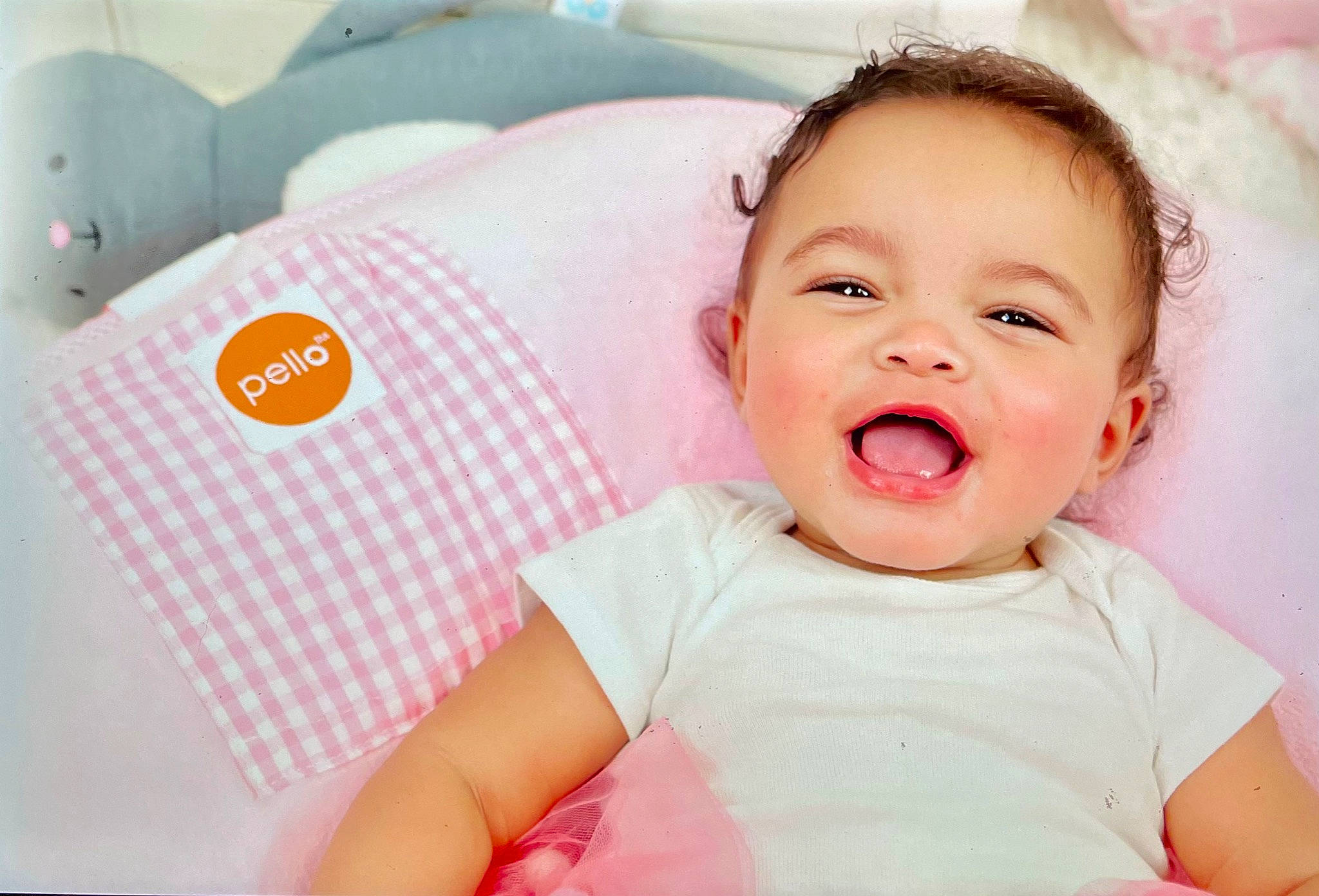 Chelsea is registered to the contest to win money with this photo: baby, baby_laughing, baby_sleeping, baby_toddler_clothing, cheek, comfort, eye, finger, happy, linens, lip, mouth, neck, nose, person, pink, skin, sleeve, smile, t_shirt