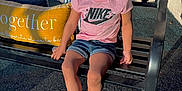 Timiyah joined the competition — help win amazing prizes! bench, braided_hair, casual_clothing, child, daytime, denim_shorts, girl, hair_accessories, happy, metal_bench, nike_logo, outdoor, pillow, pink_tshirt, portrait, shadow, smiling, sneakers, socks, sunlight