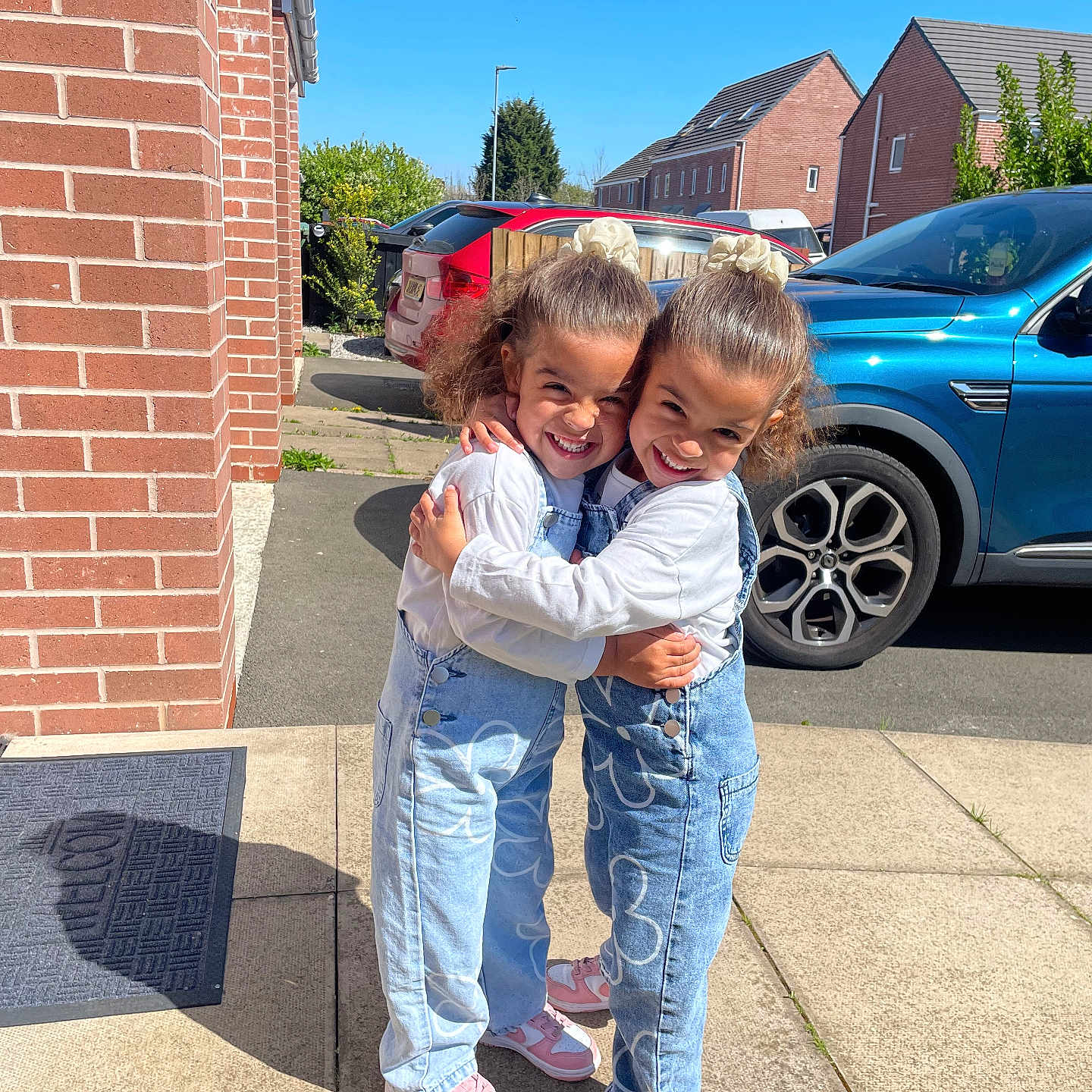 Cassie And Callie joined the competition — help win amazing prizes! alloywheel, architecture, building, city, clothing, face, footwear, head, jeans, neighborhood, outdoors, pants, person, photography, portrait, road, shelter, shoe, street, urban