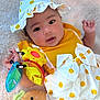 Nevaeh joined the competition — help win amazing prizes! baby, child, polka_dot, yellow, hat, toy, blanket, cute, smile, infant, playful, clothing, face, hand, soft, adorable, lying_down, colorful, happy, portrait