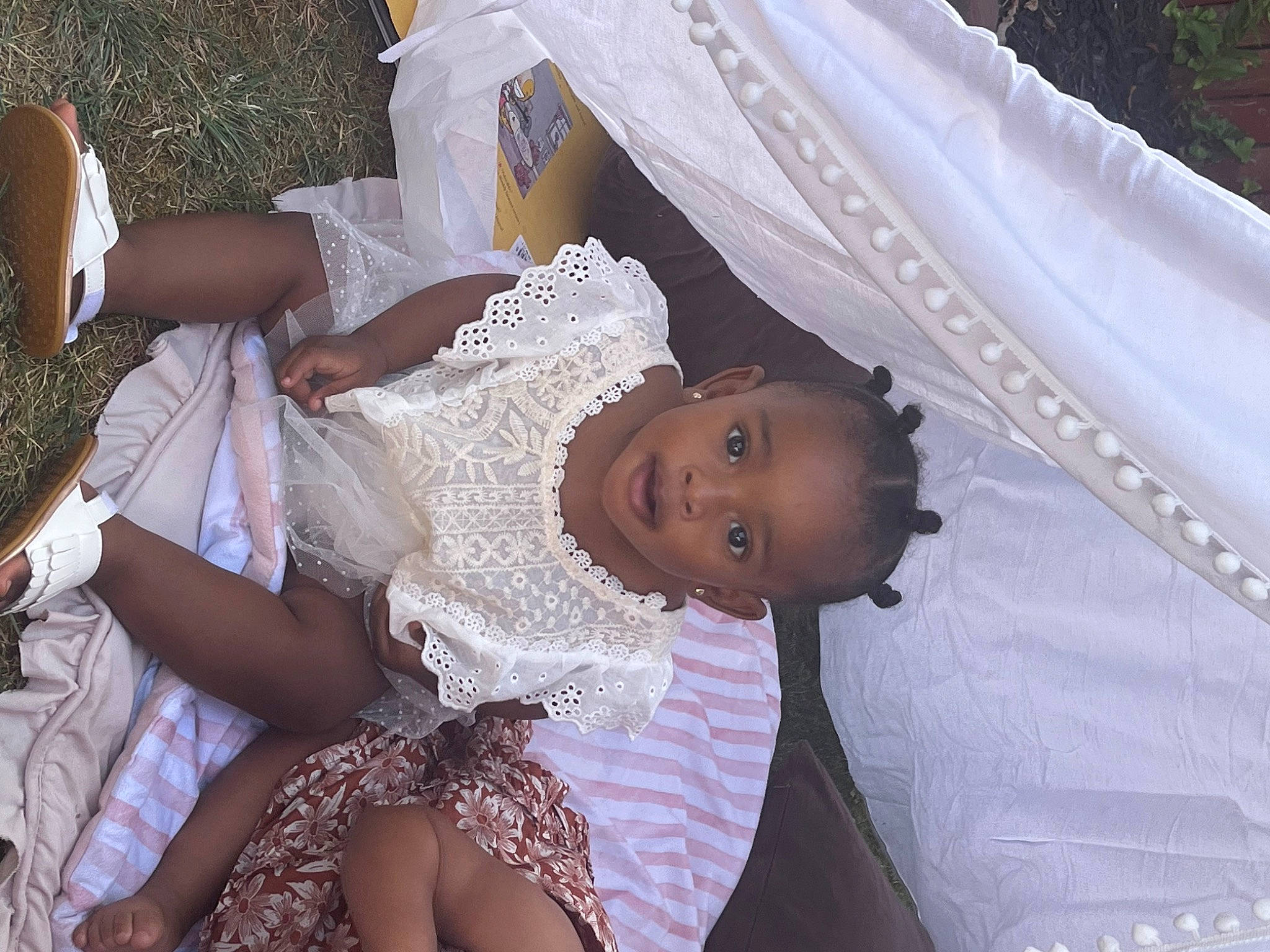 Zhuri is registered to the contest to win money with this photo: baby, bridal_accessory, bridal_clothing, bridal_veil, bride, child, dress, embellishment, event, fun, happy, human_body, interaction, person, pink, skin, smile, textile, toddler, wedding_dress