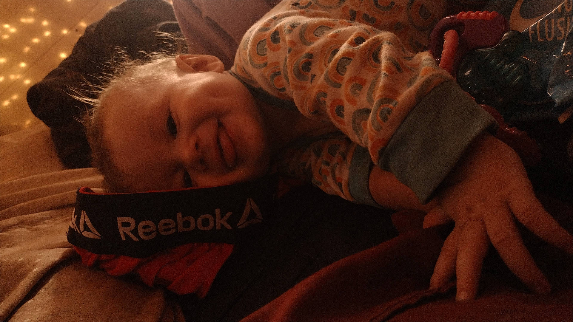 Southern is registered to the contest to win money with this photo: accessories, baby, blanket, bodypart, clothing, couch, cushion, face, finger, furniture, glove, hand, happy, head, homedecor, newborn, person, photography, portrait, smile