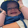 Blayn joined the competition — help win amazing prizes! baby, child, smile, teeth, hat, bucket_hat, bracelet, arm, hand, blue_clothing, person, happy, close_up, face, outdoor, sky, holding, jewelry, cute, portrait