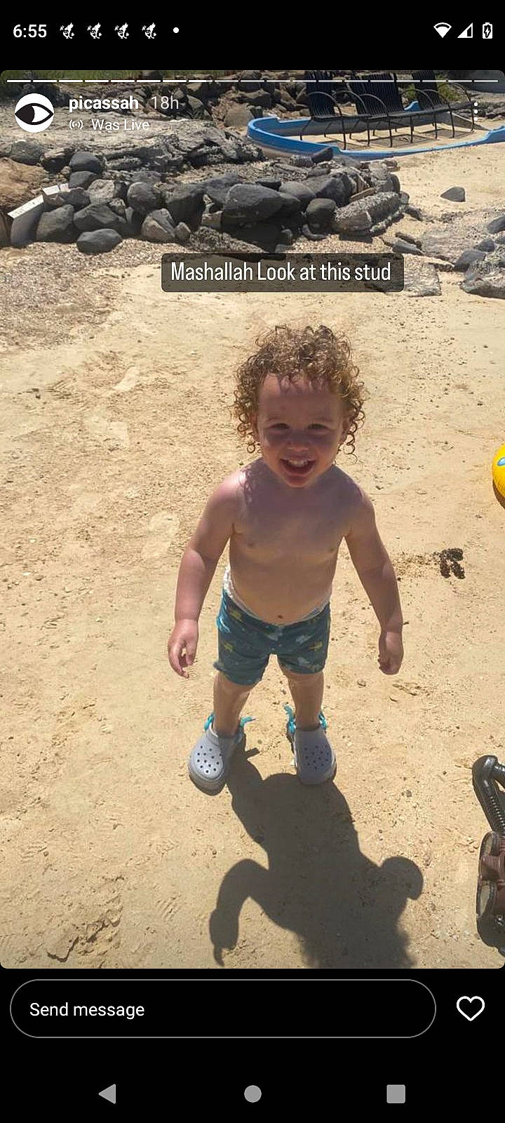 Kareem is registered to the contest to win money with this photo: barechested, beach, body_of_water, child, coast, fun, happy, joy, landscape, leisure, ocean, people_in_nature, people_on_beach, person, play, rock, sand, shore, shorts, smile