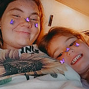 Kaylanna Rae joined the competition — help win amazing prizes! adult, child, smiling, face_filter, butterflies, blanket, sunflower, indoor, portrait, happy, casual, cozy, freckles, hair, person, closeup, relaxed, family, together, apparel