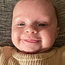 Bonnie joined the competition — help win amazing prizes! baby, cheeks, child, close_up, clothing, cute, eyes, face, happy, head, indoor, infant, lying_down, mouth, person, portrait, ribbed_fabric, skin, smile, young