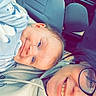 baby, blanket, car, casual, clothing, drink, eyewear, face, glasses, happy, head, indoor, person, portrait, relaxation, seat, seatbelt, smile, straw, woman