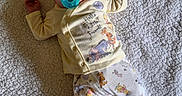 Oaklei Storm joined the competition — help win amazing prizes! baby, infant, pacifier, blanket, pajamas, winnie_the_pooh, heart_shaped_sign, one_month, cute, sleepwear, child, newborn, soft_texture, lying_down, indoors, cozy, yellow_hat, foot, hand, baby_clothes