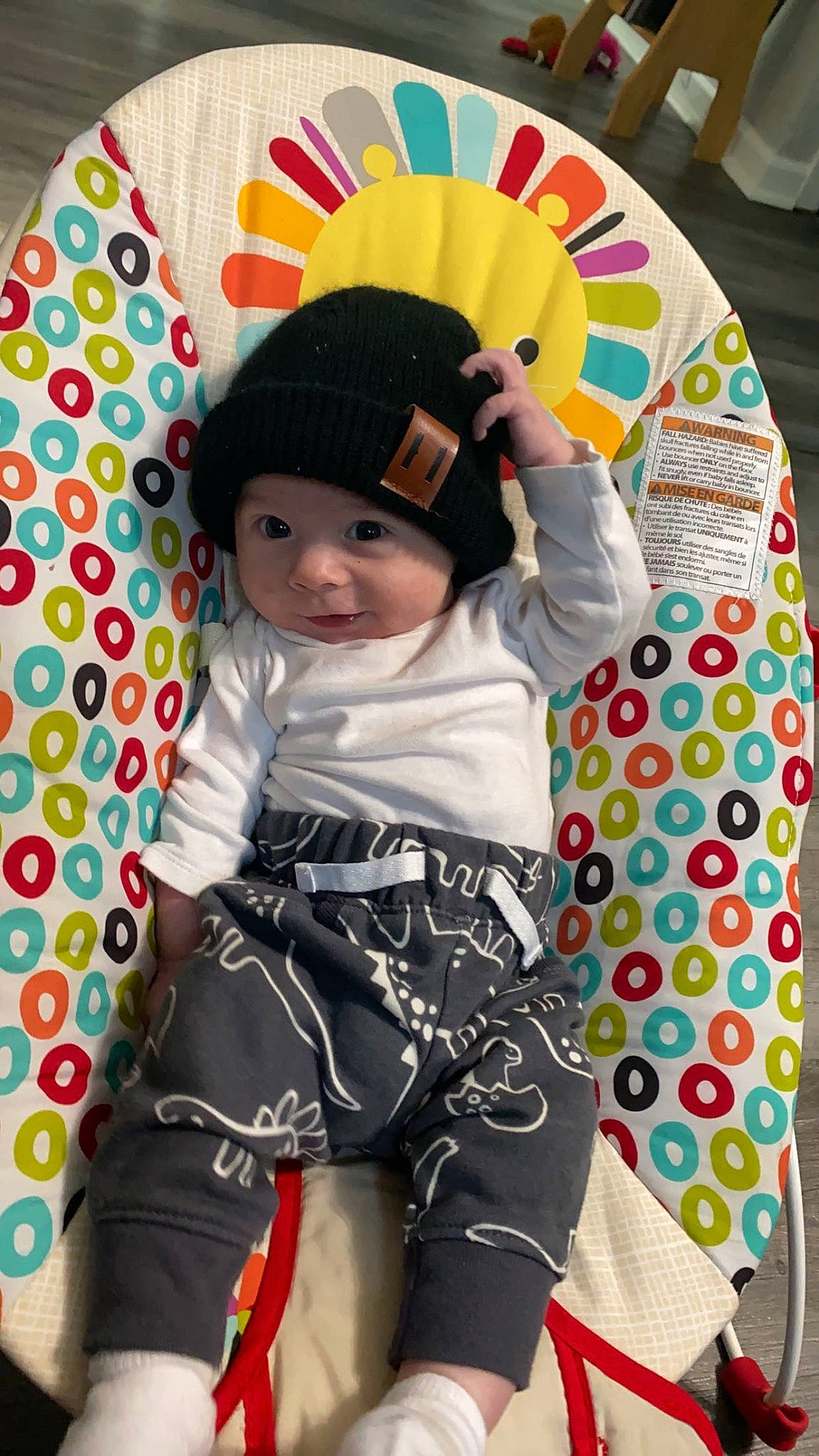Kamden is registered to the contest to win money with this photo: baby, baby_products, baby_toddler_clothing, cap, child, comfort, face, fashion_accessory, fun, happy, headgear, headwear, linens, pattern, person, personal_protective_equipment, play, sitting, sleeve, t_shirt