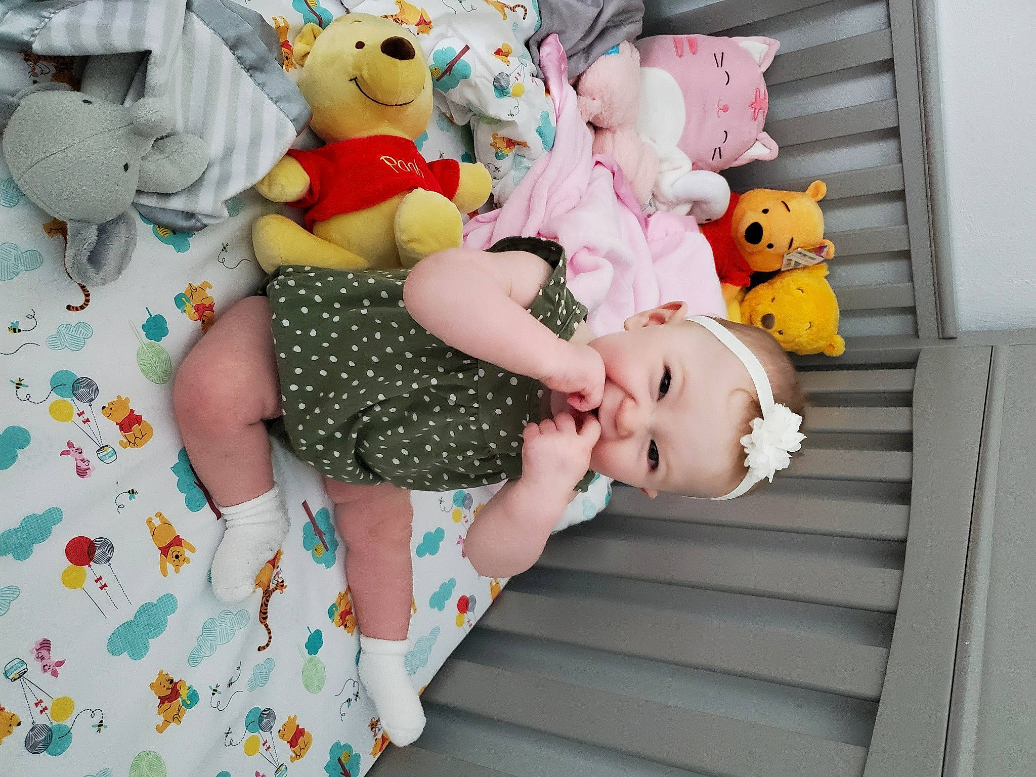 Aubrey is registered to the contest to win money with this photo: baby, baby_products, bed, child, doll, furniture, linens, person, pink, plush, product, room, stuffed_toy, teddy_bear, textile, toddler, toy, yellow