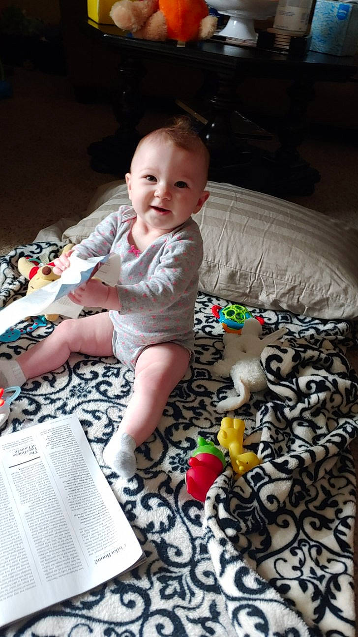 Aubrey is registered to the contest to win money with this photo: baby, cheek, child, joy, person, play, room, sitting, skin, toddler