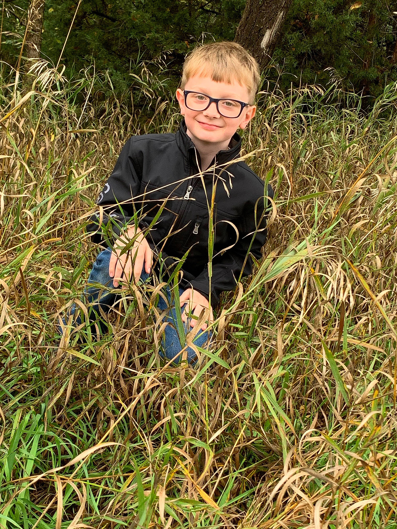 Ryland is registered to the contest to win money with this photo: agriculture, crop, flowering_plant, glasses, grass, grass_family, grassland, groundcover, herb, joy, lawn, meadow, pasture, people_in_nature, person, plant, poales, prairie, recreation, smile
