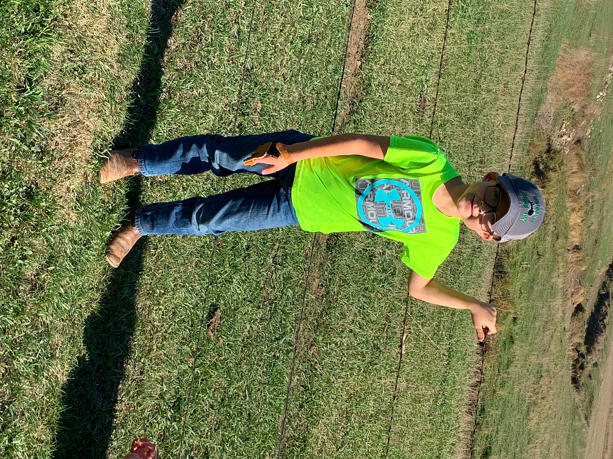 Brynlee joined the competition — help win amazing prizes! elbow, fun, grass, grass_family, grassland, green, happy, headwear, joy, knee, lawn, leg, leisure, nature, people_in_nature, person, plant, recreation, shorts, sportswear